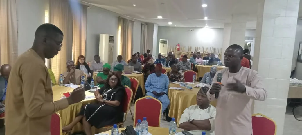 A participant addressing stakeholders during the cocoa quality standards dialogue in Akure